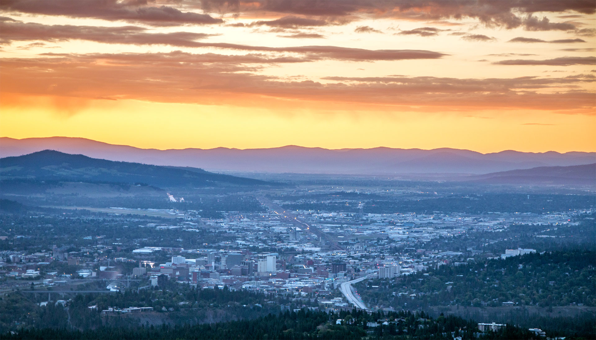 Sunrise looking East over Downtown Spokane from a Helicopter